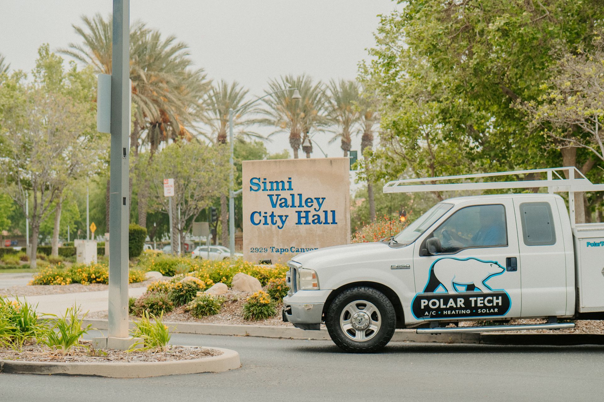 A Polar Tech HVAC truck is parked on the side of the road
