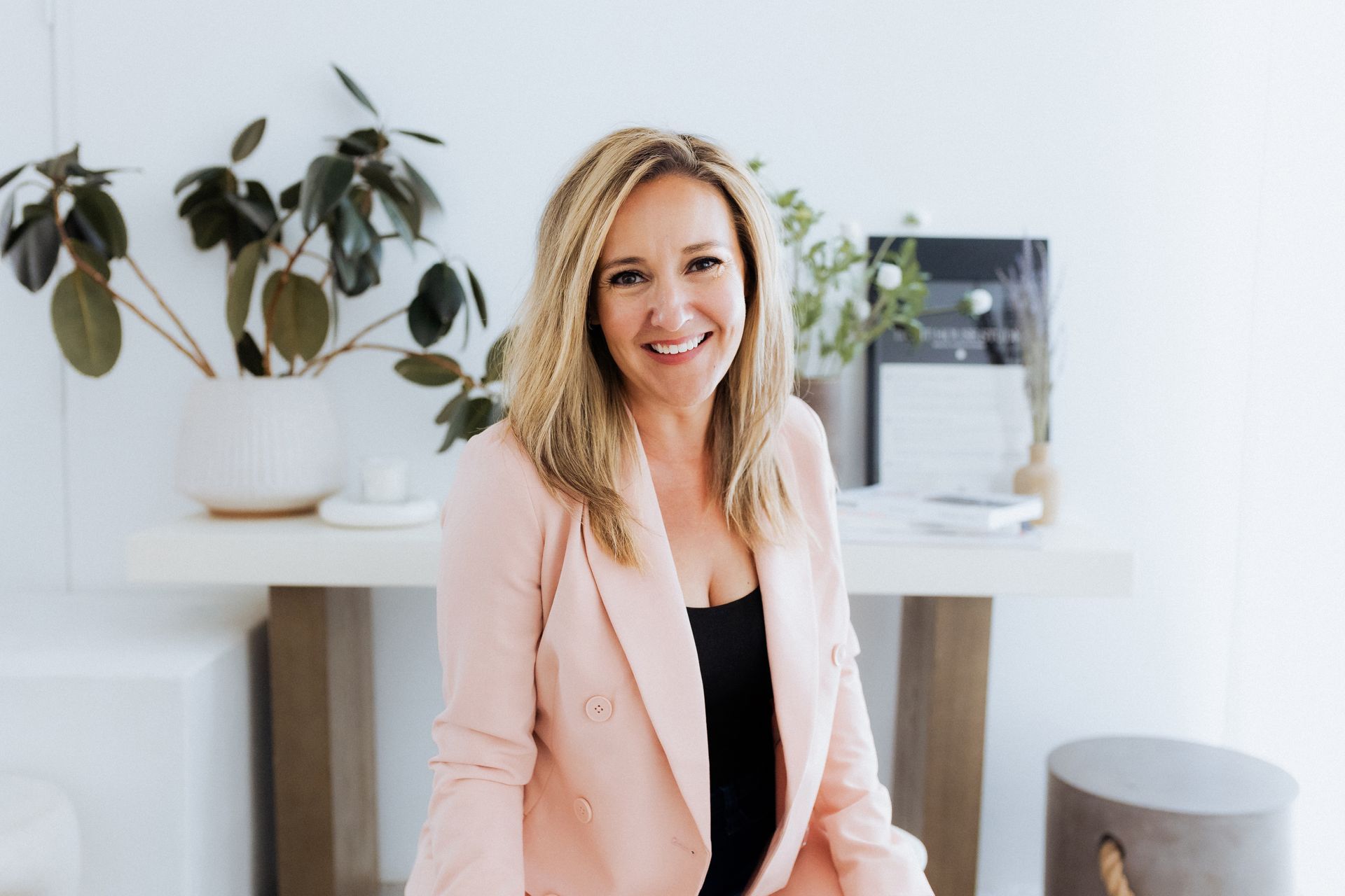 Kate Lang, experienced Albuquerque realtor, in a stylish white blazer.