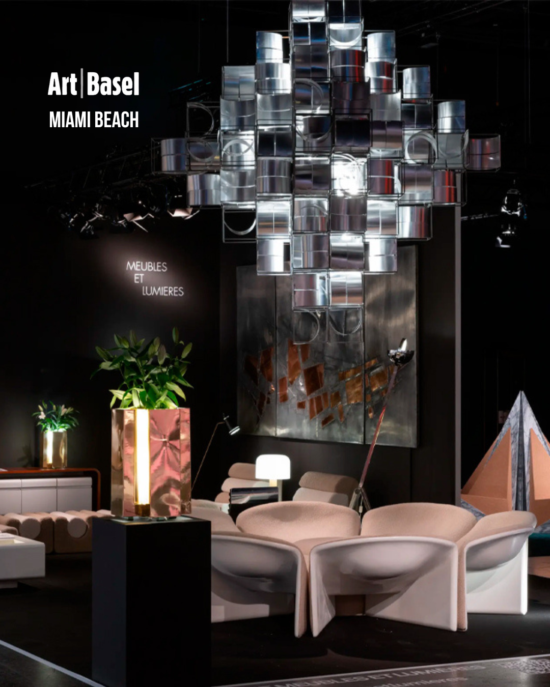 A room with chairs and a chandelier that says art basel miami beach