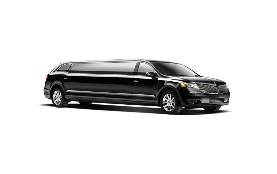 A black limousine is parked on a white background.