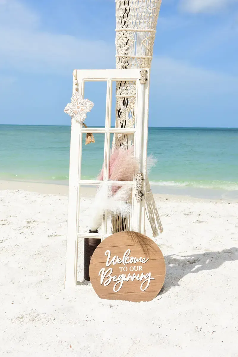 Beach wedding decor: wooden sign saying 