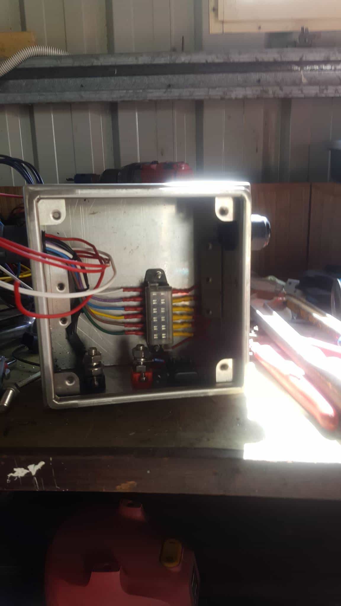 A Box With Wires Coming Out of It is Sitting on a Table — Jacko's Auto & Marine Electrics In Mackay Harbour, QLD