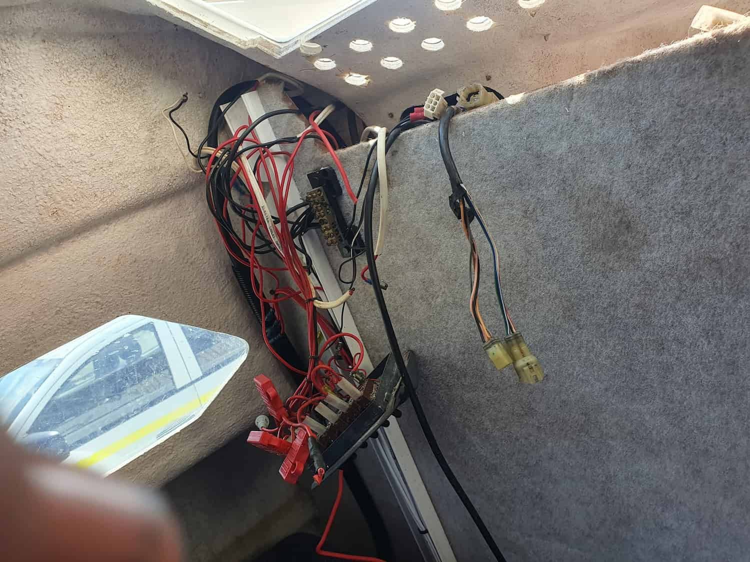 A Bunch of Wires Are Hanging From a Wall in a Room — Jacko's Auto & Marine Electrics In Mackay Harbour, QLD