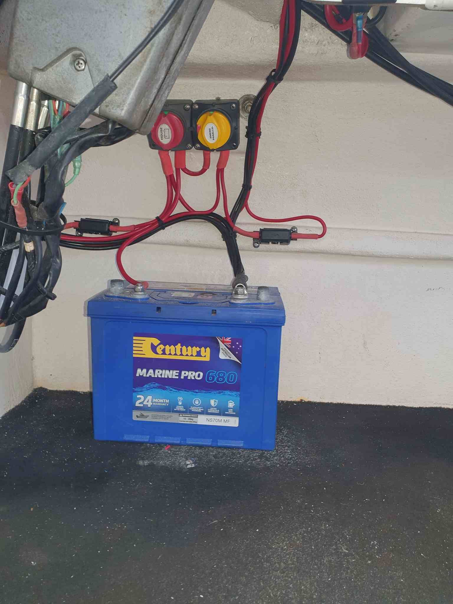 The Inside of a Boat With a Steering Wheel and a Fire Extinguisher — Jacko's Auto & Marine Electrics In Mackay Harbour, QLD