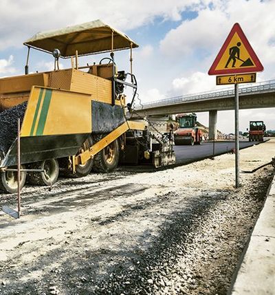Patching Services — Road Under Construction Being Paved in Indianapolis, IN
