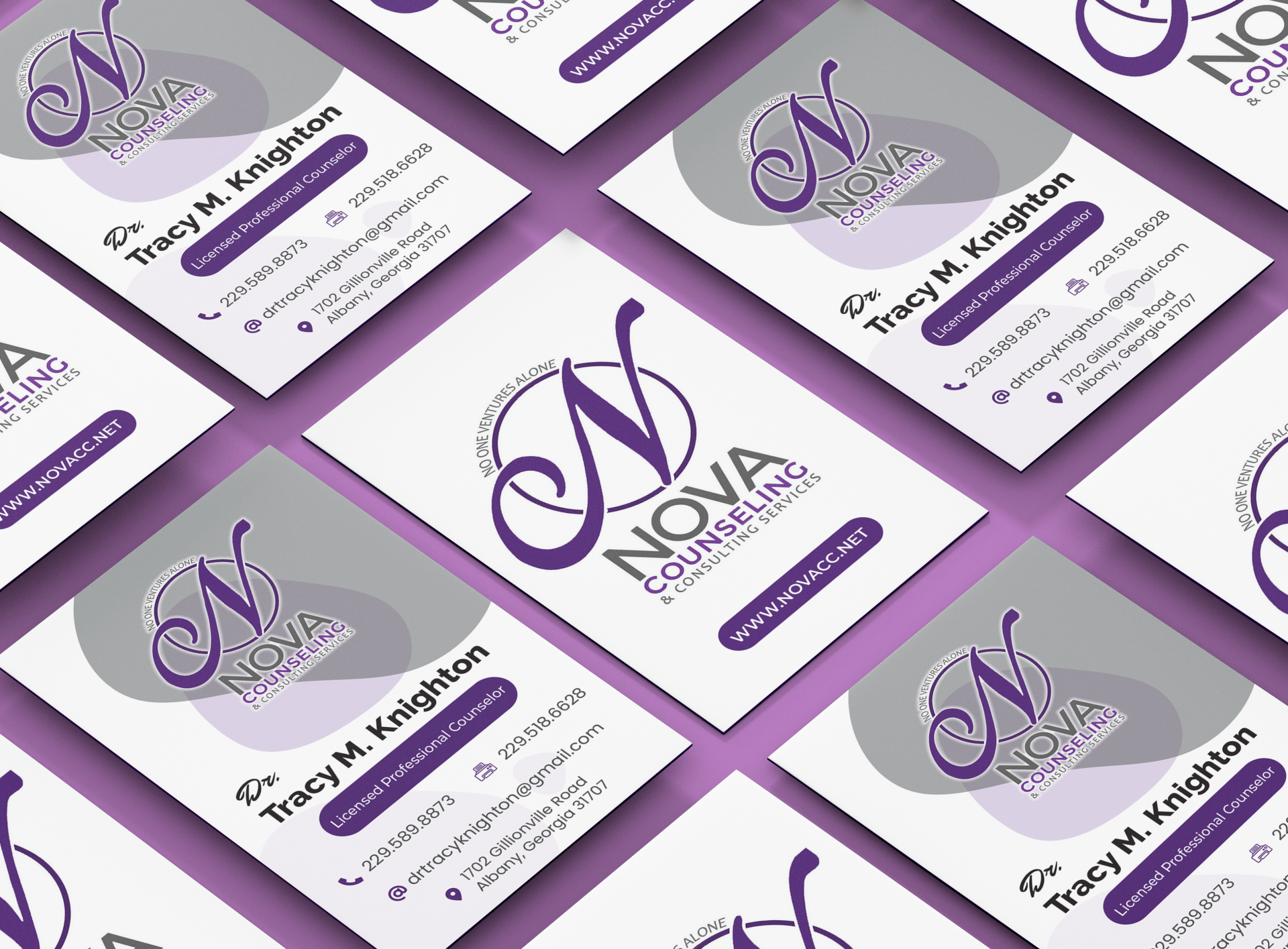 a bunch of business cards are stacked on top of each other .