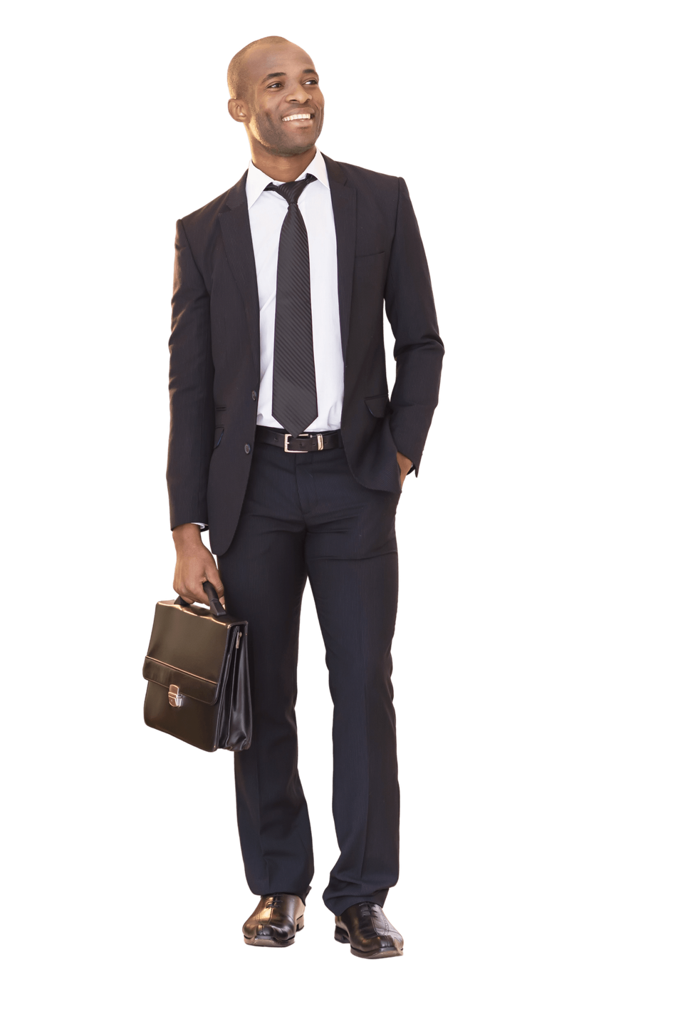 a man in a suit and tie is holding a briefcase .