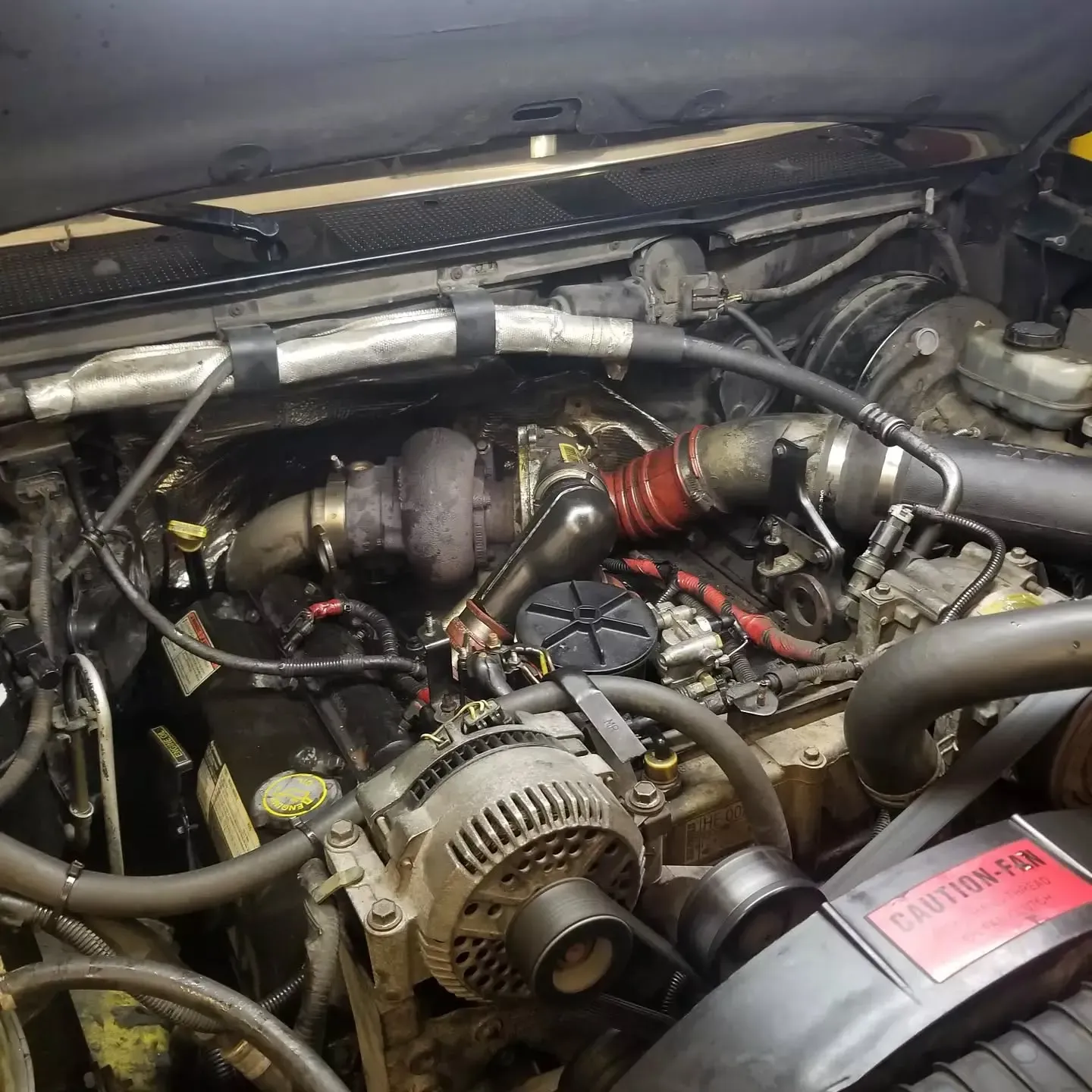 Diesel engine compartment with a turbocharger installed.