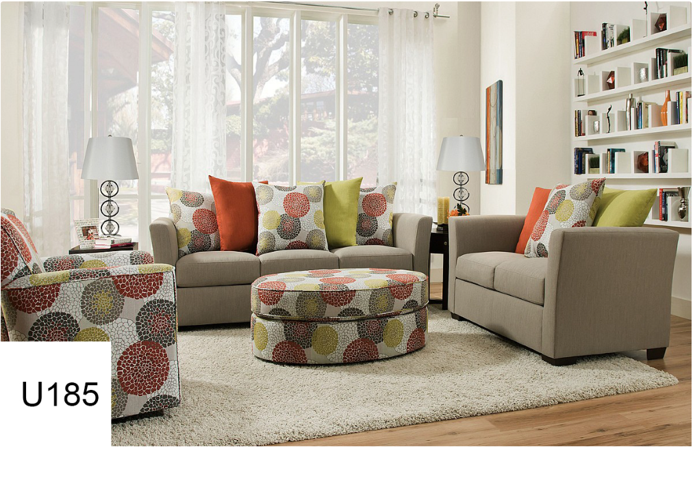 A living room with a couch a chair and an ottoman