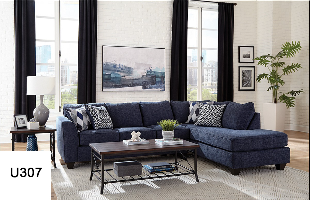 A living room with a blue sectional couch and a coffee table