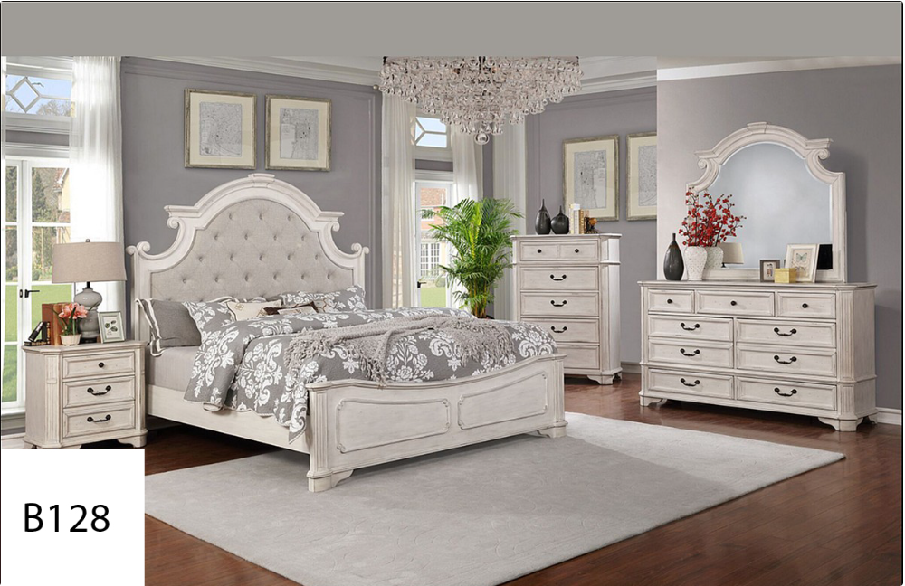 A bedroom with a bed , dresser , nightstand , mirror and rug.