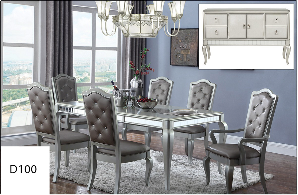 A dining room with a table and chairs and a dresser.