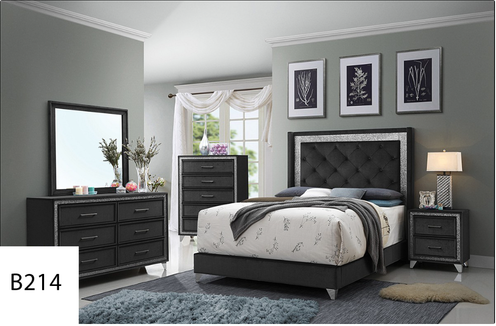 A bedroom with a bed , dresser , nightstand , mirror and rug.