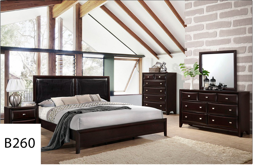 A bedroom with a bed dresser mirror and nightstand