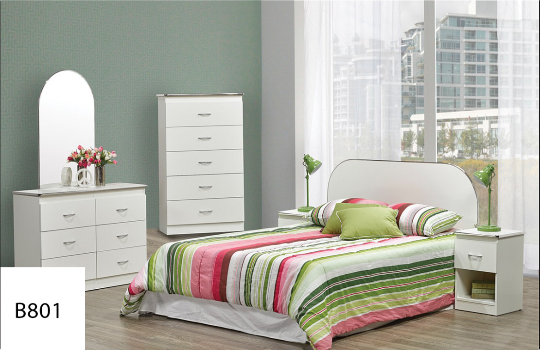 A bedroom with a bed , dresser , nightstand and mirror.