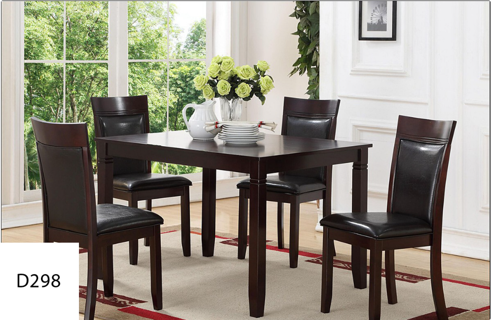 A dining room table with four chairs and a vase of flowers on it