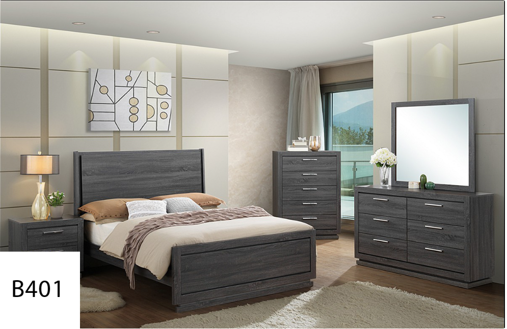 A bedroom with a bed , dresser , nightstand and mirror.