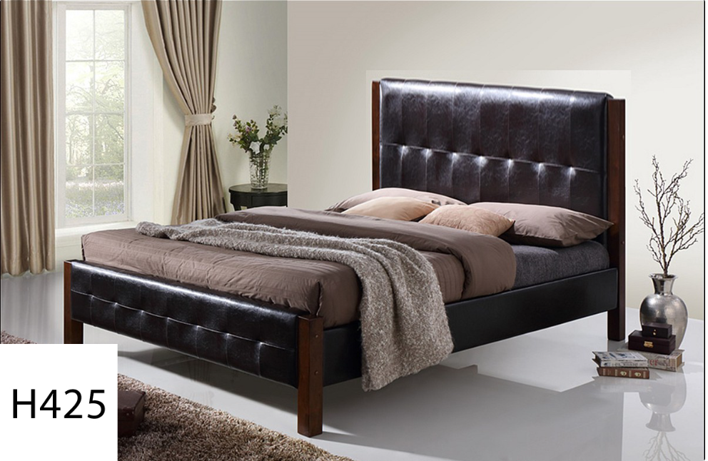 A bedroom with a bed and a vase of flowers