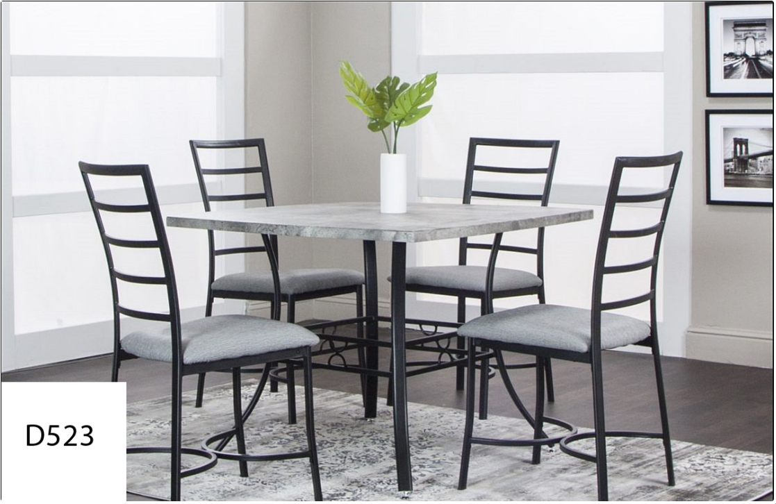 A dining room table with four chairs and a plant on it