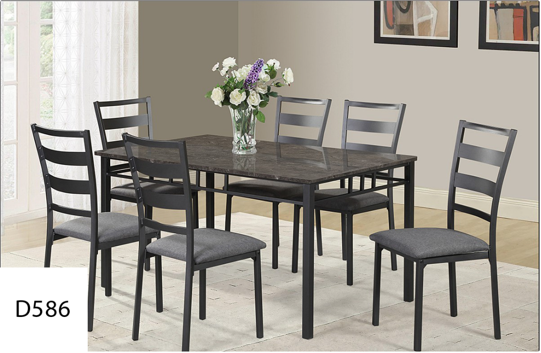 A dining room table and chairs with a vase of flowers on it
