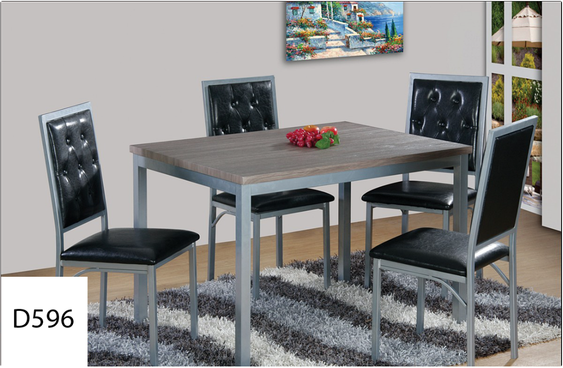 A dining room table with four chairs and a rug