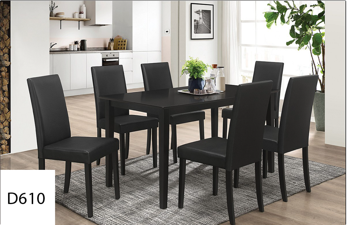 A dining room set with black chairs and a table