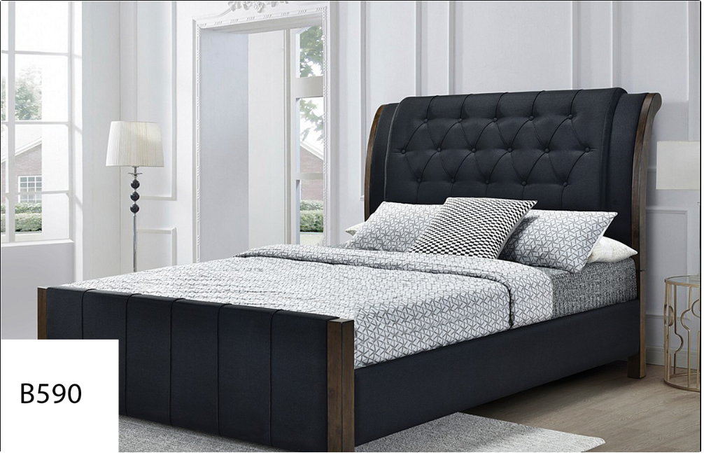 A bed with a black headboard is sitting in a bedroom next to a window.