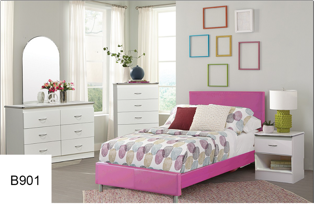 A bedroom with a pink bed , dresser , nightstand and mirror.