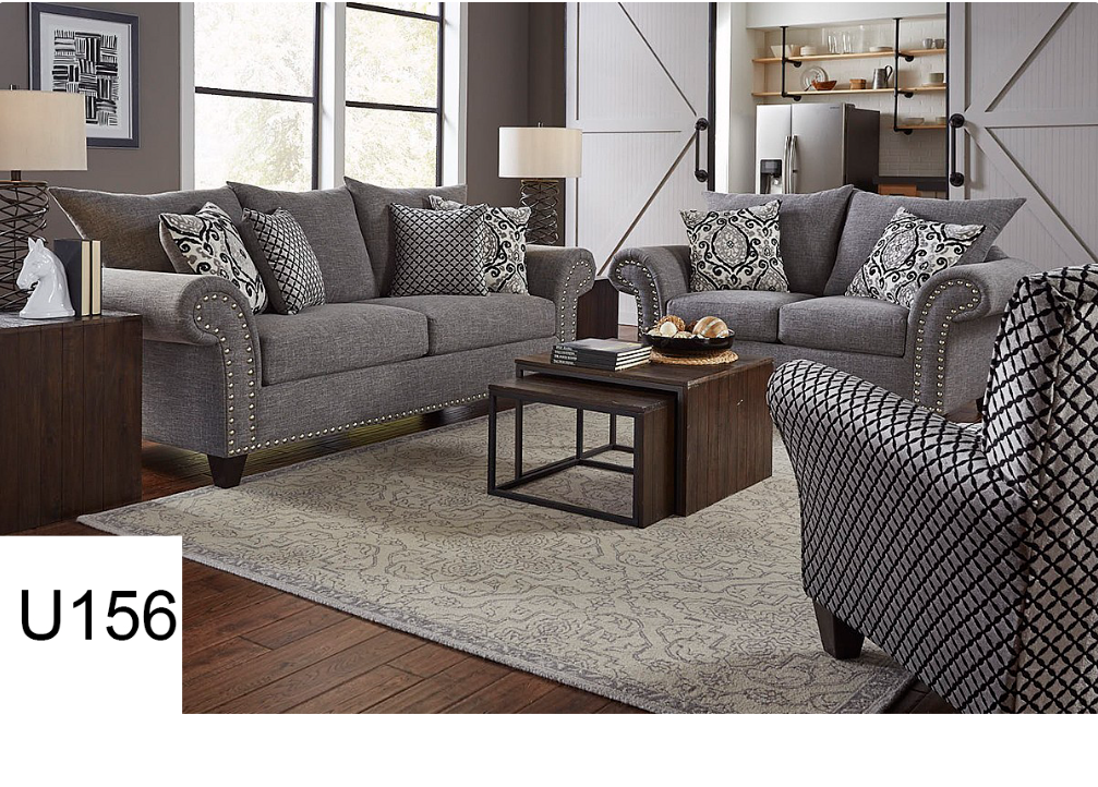 A living room with a couch a chair and a coffee table