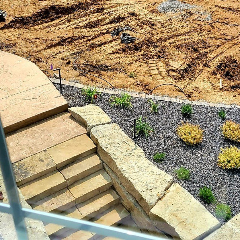 An aerial view of a construction site with stairs and plants