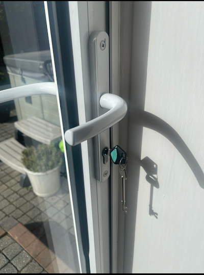 A close up of a door with a key in it