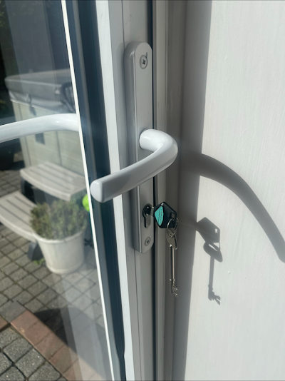 A close up of a door with a key on it
