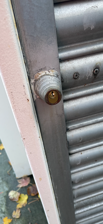 A close up of a door with a screw in it.