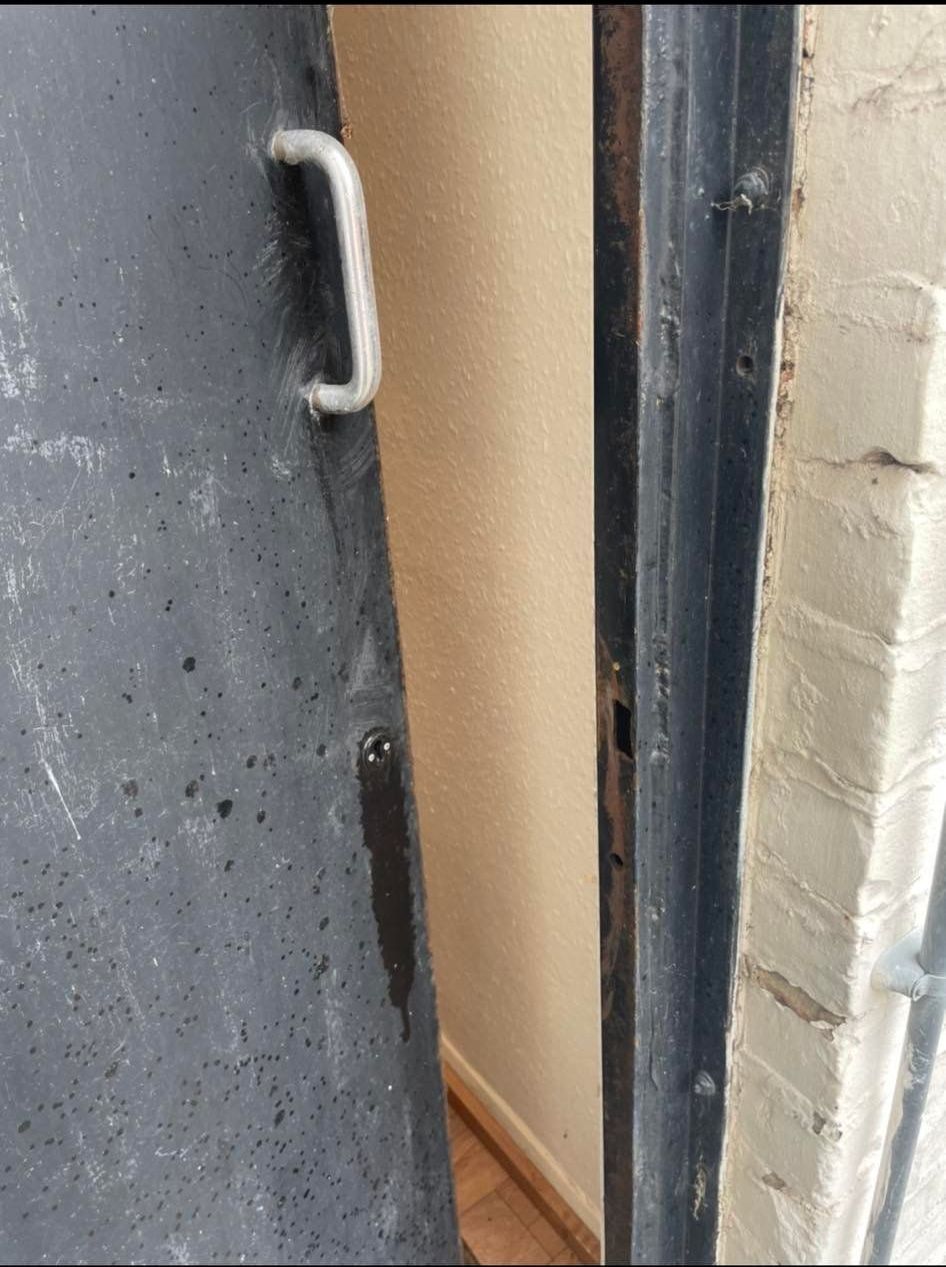 A close up of a door with a handle on it.