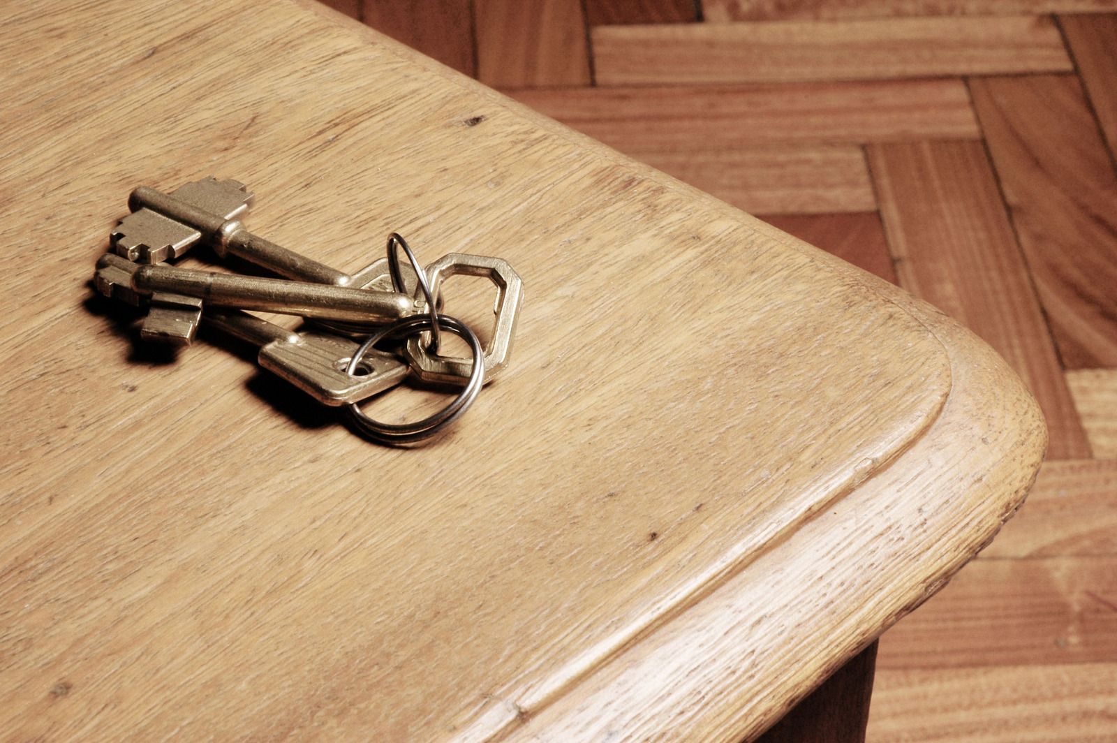 A person is using a screwdriver to open a door lock.