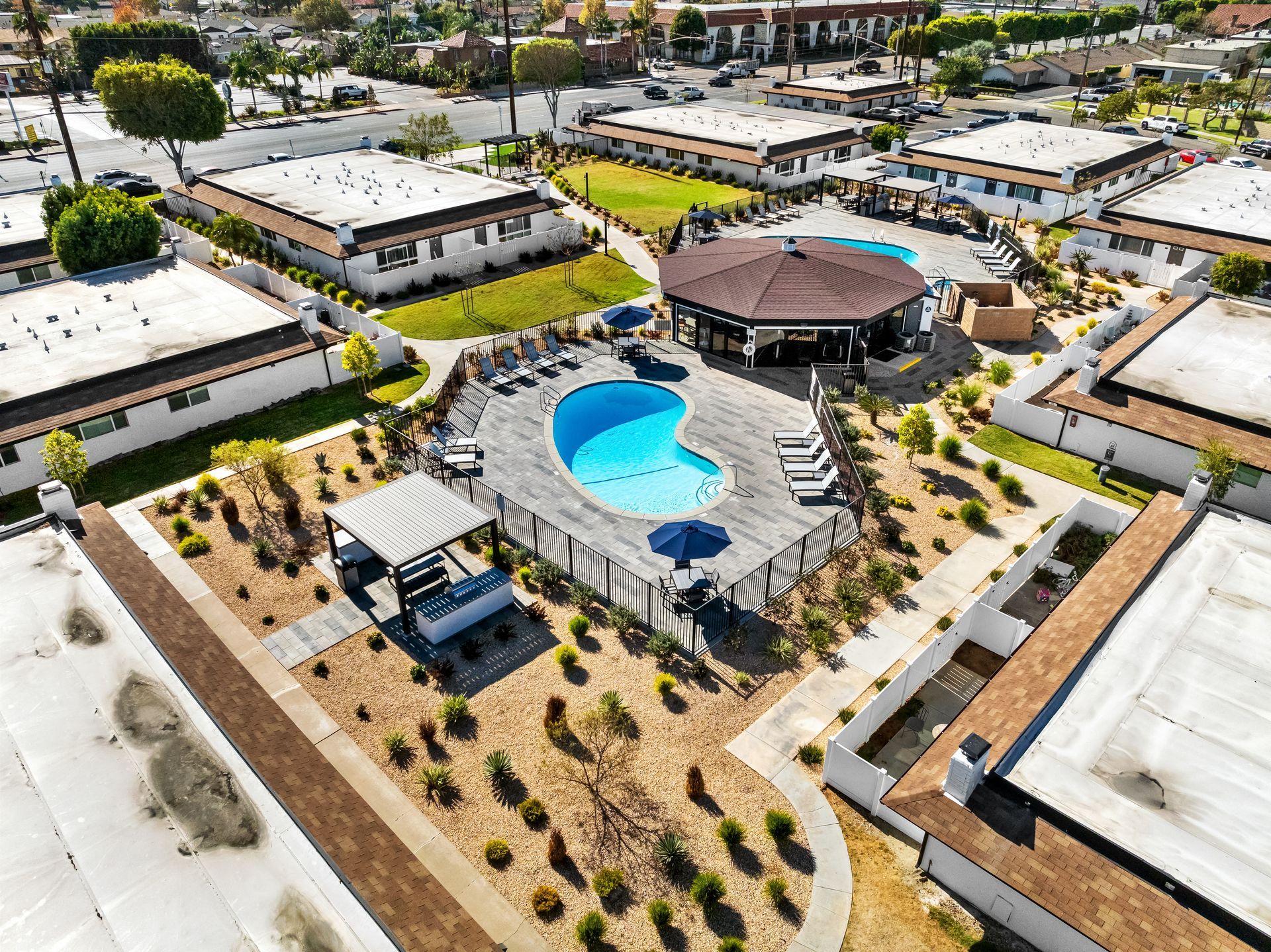 drone view of pool and BBQs