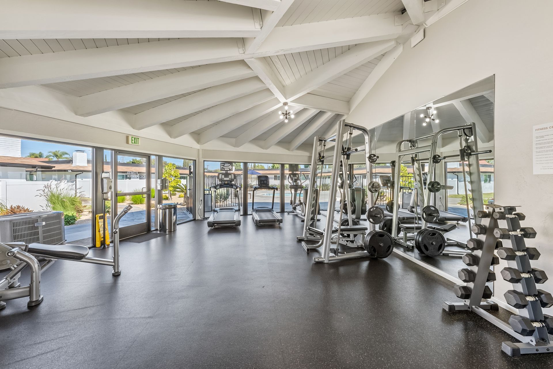 gym with cardio equipment and weights