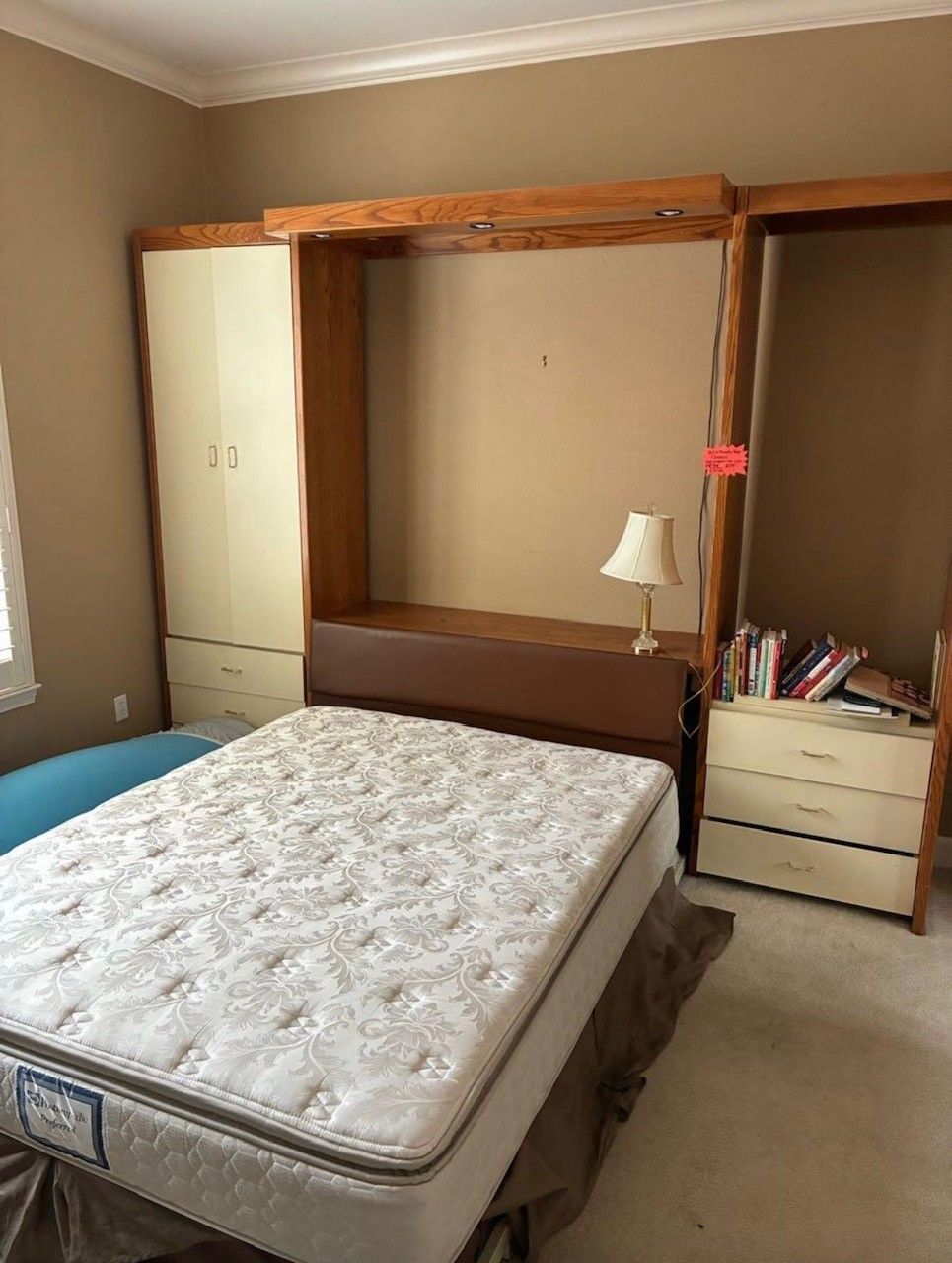 Cleanup King LLC - Bedroom with a bed, built-in headboard with a shelf, two dressers, and a wardrobe.