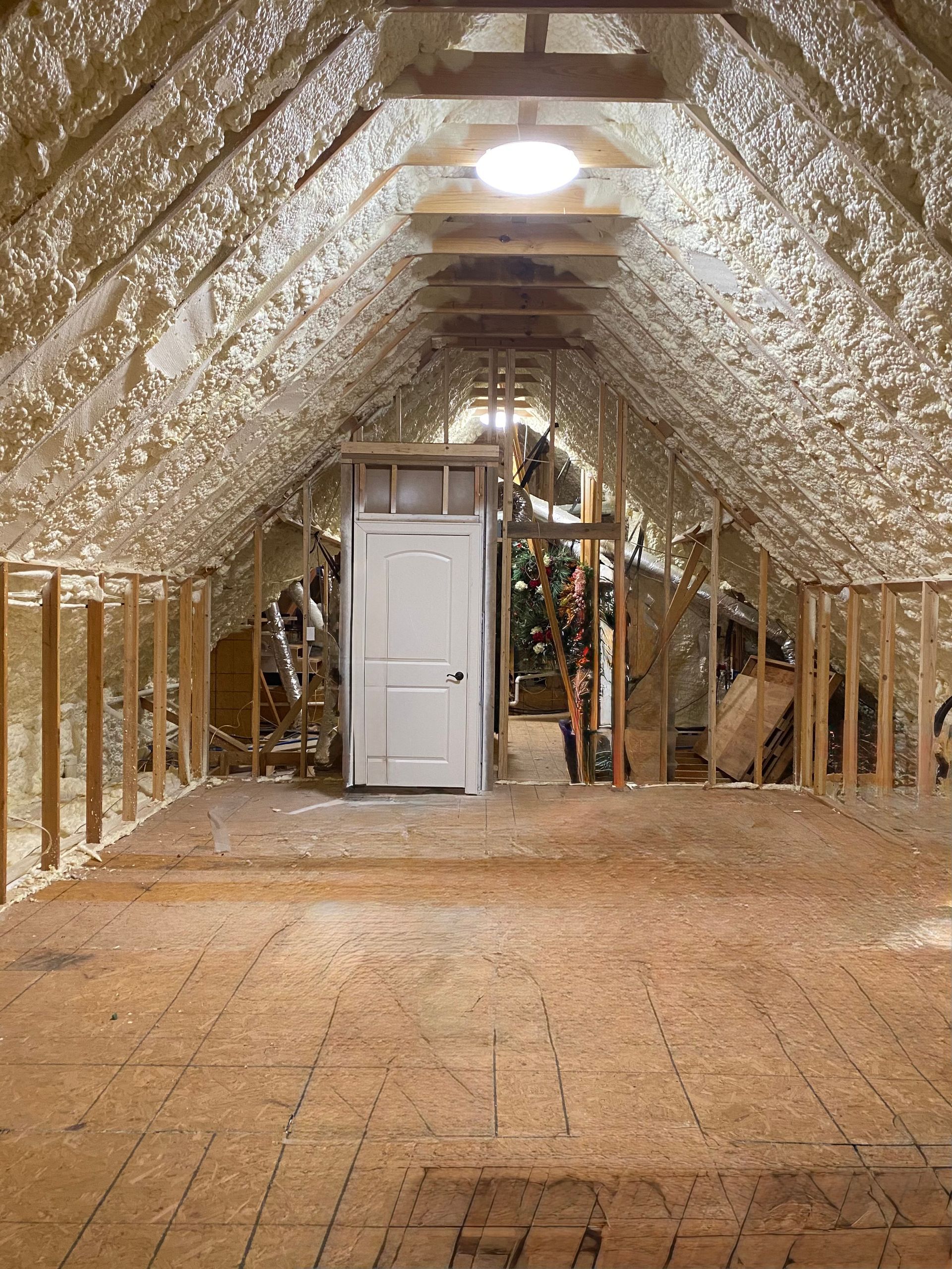 Unfinished attic space in Tyler, TX, awaiting renovation by Night 'N' Day Construction to be transformed into a spacious bedroom, bathroom, and a large walk-in closet
