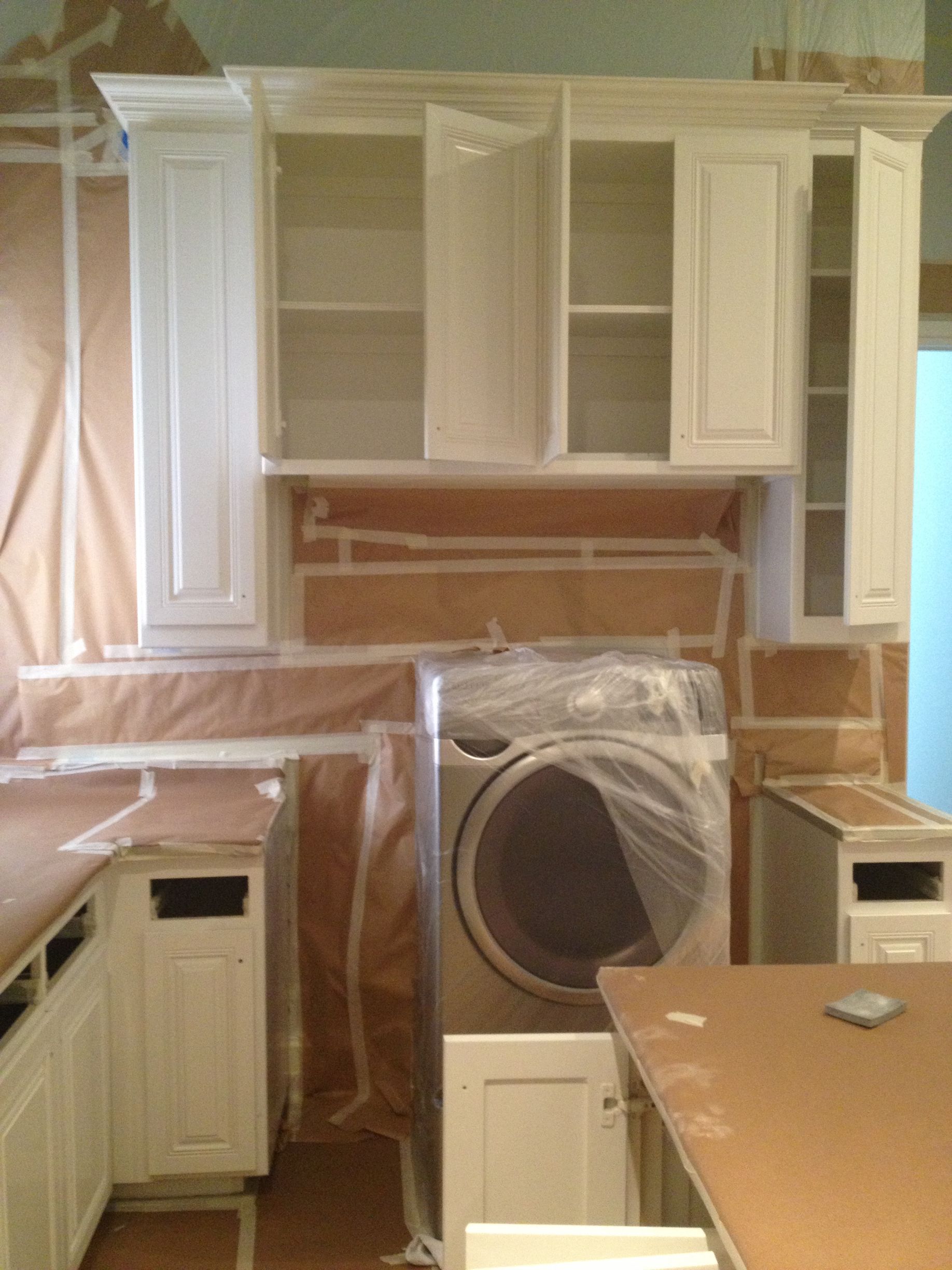 Night 'N' Day Construction tarping the interior of a home in Flowermound, Tx, preparing for an interior renovation as part of an insurance claim