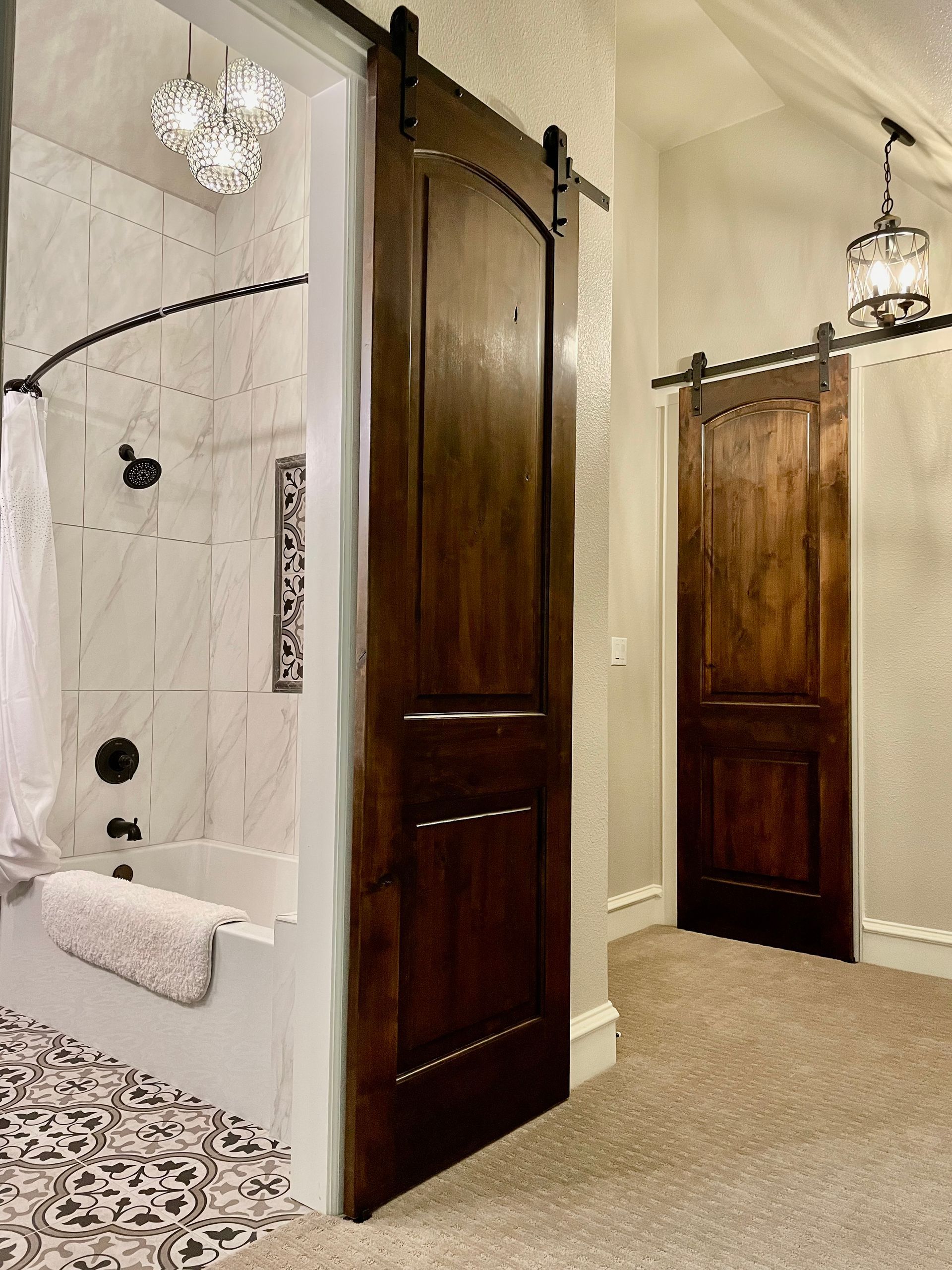 Completed attic renovation by Night 'N' Day Construction in Tyler, TX, transformed into a spacious bedroom, bathroom, and a large walk-in closet.