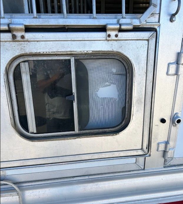 A small window on the back of a trailer
