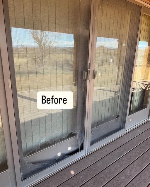 A sliding glass door with a before sign on it.