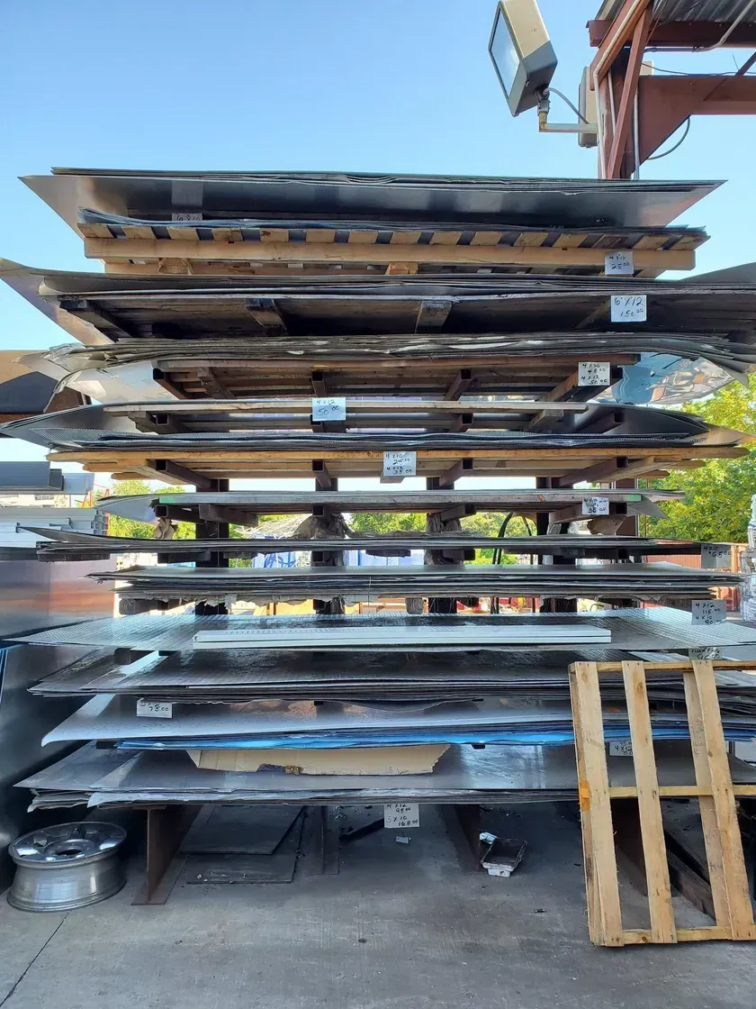 A stack of metal sheets sitting on top of each other.