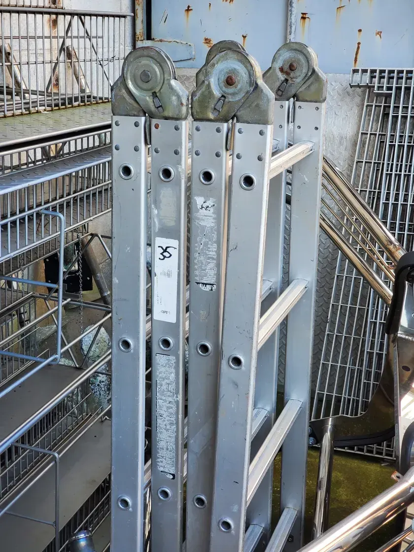 A ladder is stacked on top of each other in a warehouse.