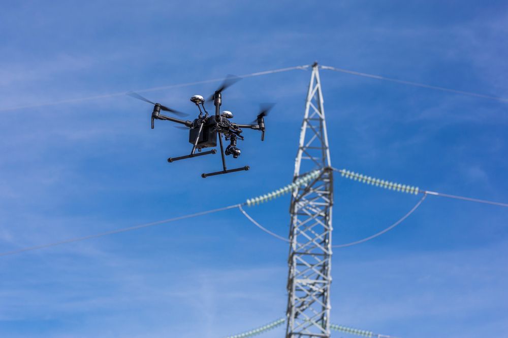 drone undertaking high voltage power line Inspection - Tailored Spatial Solutions in Cairns City, QLD
