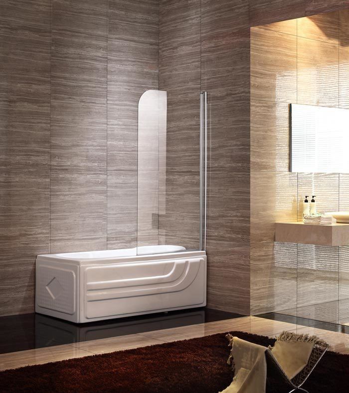 Modern white bathtub with glass shower screen in a bathroom with brown tile walls.