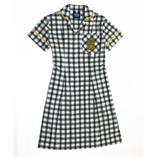 Plaid school dress with green and white checks, yellow trim, and embroidered crest.