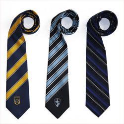 Three striped neckties, navy with gold, black and gray, and navy with blue stripes.
