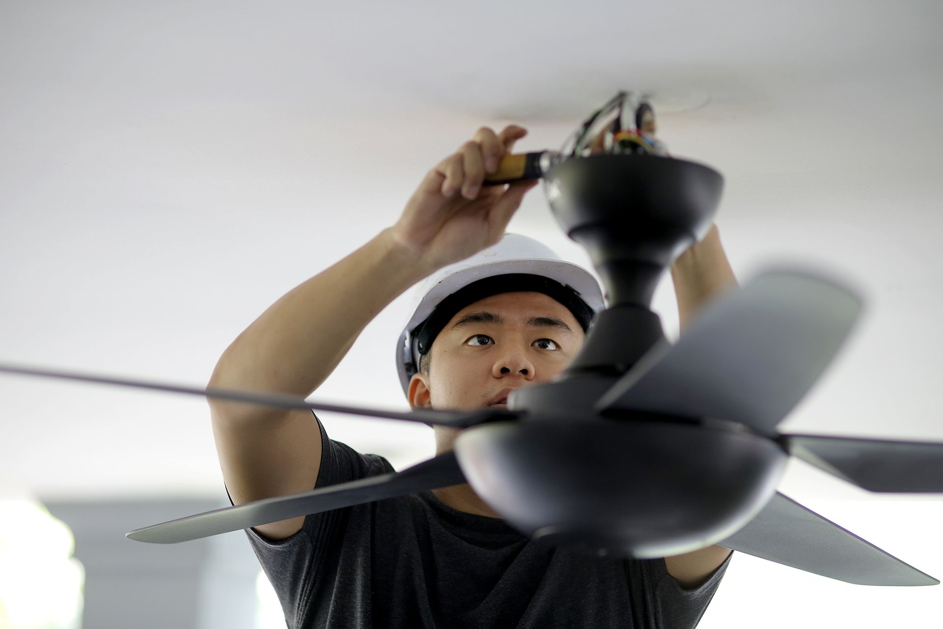 Anderson Technician repairing ceiling fan.